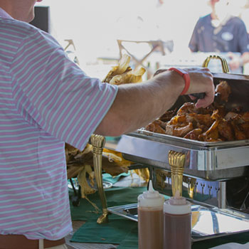 Guests grab some of Club's famous BBQ