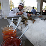 Enjoys oysters at the bar or delivered to your table.