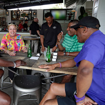 Guests having a beer and a laugh at The Eagles Nest